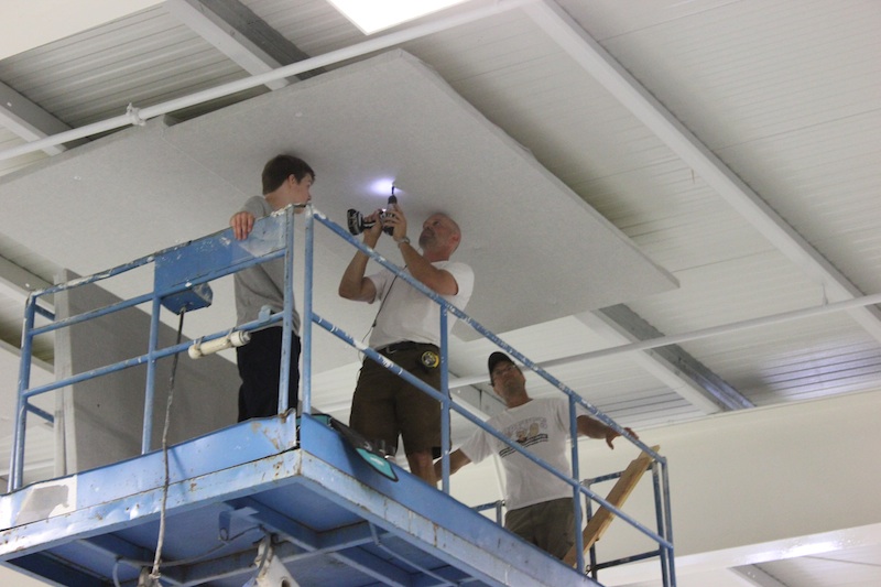 Lake Cowichan Arena : 2" Acousti-trac - Installation crew installing one of 150 panels.